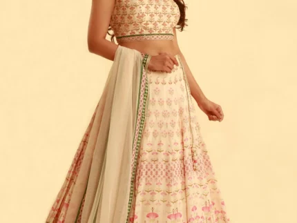 pink printed lehenga set with contrast fern green colour and matching tulle dupatta